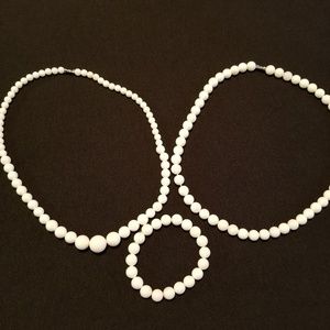 Hand carved tridacna necklaces and bracelet